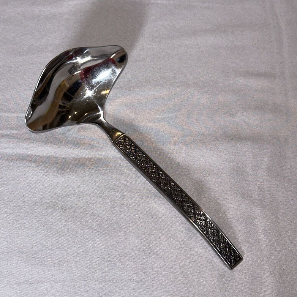 INTERNATIONAL SILVER IS ROGERS VOGUE STAINLESS FLATWARE - GRAVY LADLE